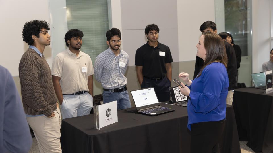 SCI's Jennifer Whitlow speaks with a team presenting at the new entrepreneur section of Junior Design Capstone. Photos by Terence Rushin/ College of Computing.